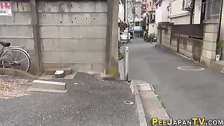 Asian relieves herself